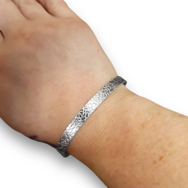 Sterling silver bangle with bold leaf texture